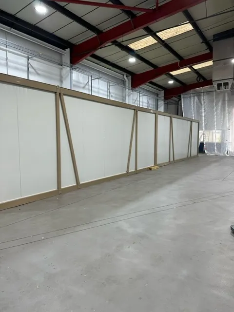 Long run of cold room panels along a warehouse wall